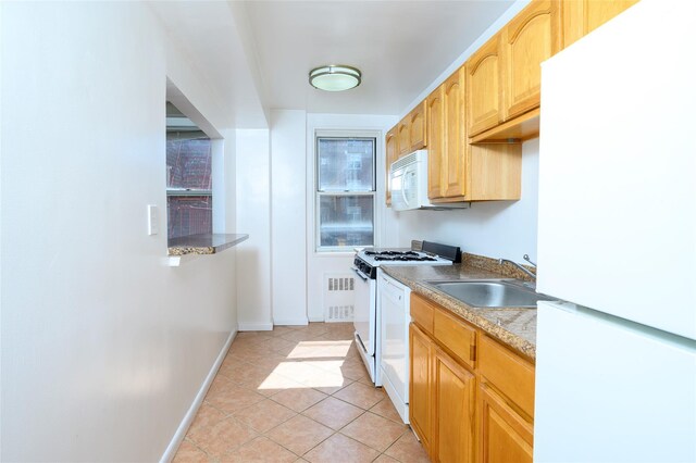 4 Sadore Ln Unit 3M, Yonkers, NY 10710 - kitchen with white appliances, a sink, light brown cabinets, light tile patterned floors, and baseboards