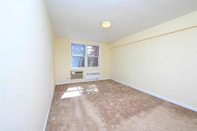 4 Sadore Ln Unit 3M, Yonkers, NY 10710 - carpeted spare room featuring radiator heating unit, a wall mounted air conditioner, and baseboards