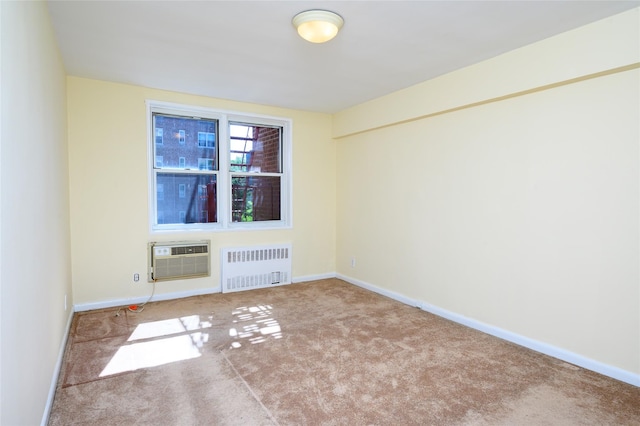 4 Sadore Ln Unit 3M, Yonkers, NY 10710 - carpeted empty room featuring radiator, a wall mounted air conditioner, and baseboards