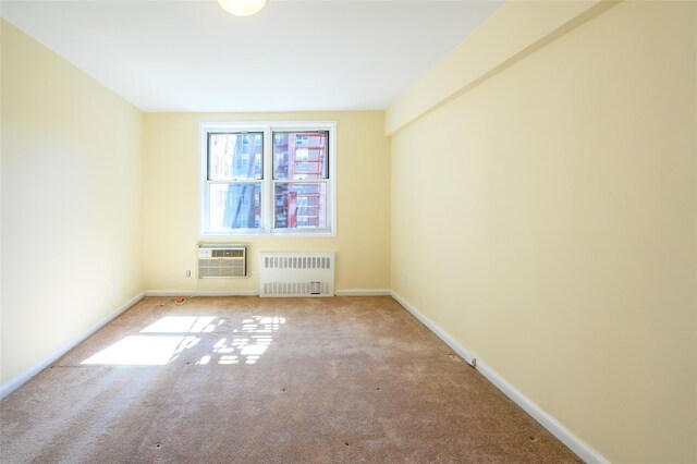4 Sadore Ln Unit 3M, Yonkers, NY 10710 - carpeted spare room featuring radiator heating unit, baseboards, and an AC wall unit
