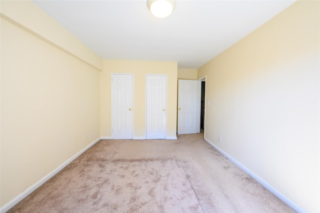 4 Sadore Ln Unit 3M, Yonkers, NY 10710 - unfurnished bedroom with baseboards and light colored carpet