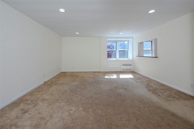 4 Sadore Ln Unit 3M, Yonkers, NY 10710 - unfurnished room with radiator heating unit, carpet flooring, recessed lighting, and baseboards