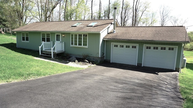 10 Aspinwall Rd, Red Hook, NY 12571 - single story home with roof with shingles, an attached garage, driveway, and a front lawn