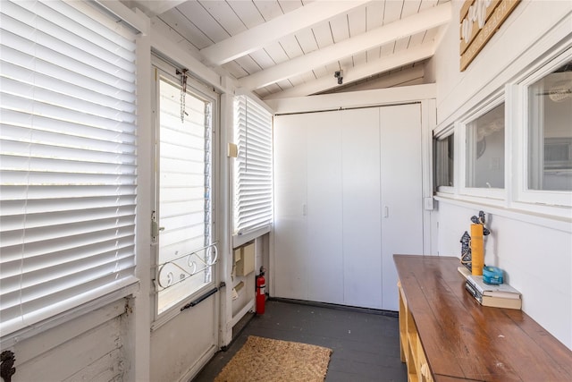 entryway featuring vaulted ceiling with beams and wood ceiling
