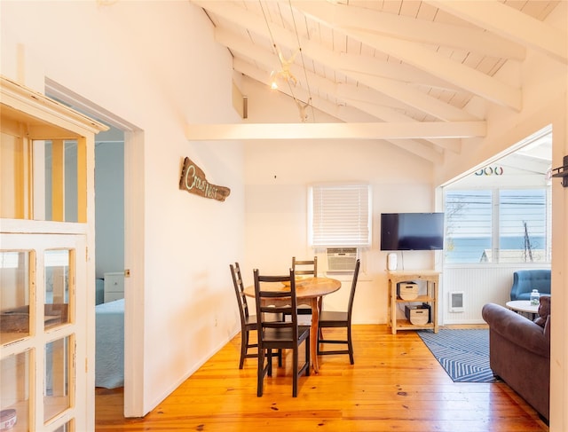 dining area with lofted ceiling with beams, wood ceiling, cooling unit, and hardwood / wood-style flooring