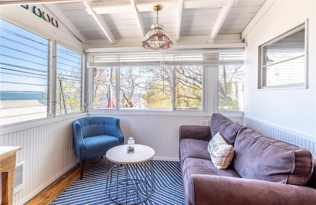 sunroom with visible vents and beamed ceiling