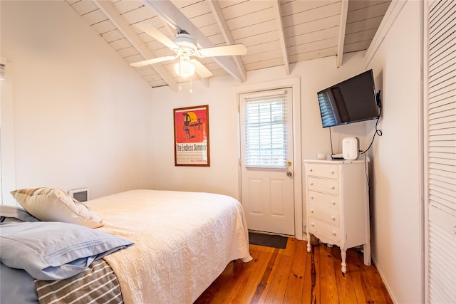 bedroom with wood-type flooring, ceiling fan, lofted ceiling with beams, and wooden ceiling