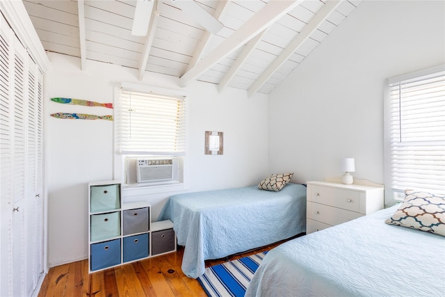 bedroom featuring wood ceiling, vaulted ceiling with beams, cooling unit, and hardwood / wood-style flooring