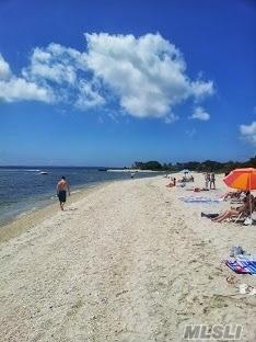 property view of water featuring a beach view
