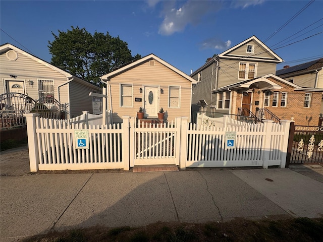 bungalow-style home featuring a fenced front yard