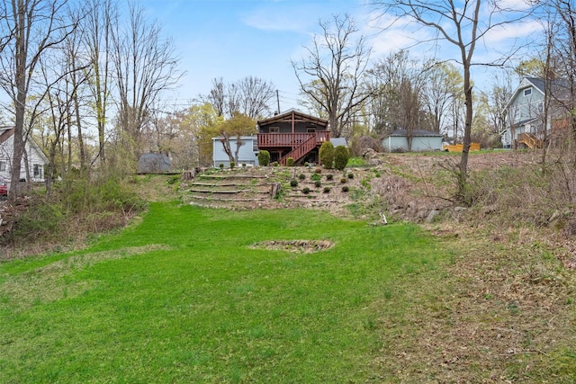view of yard with stairway and a wooden deck