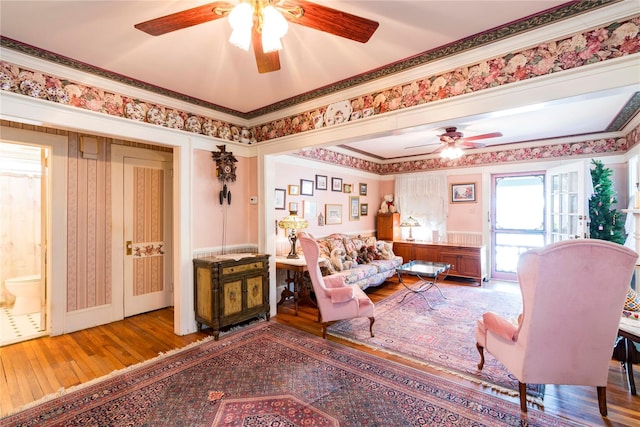 44 Jackson St, Fishkill, NY 12524 - living room with ornamental molding, wainscoting, ceiling fan, and hardwood / wood-style floors