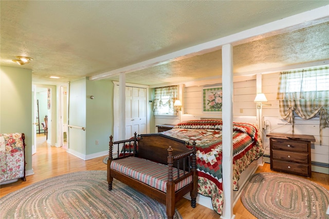 44 Jackson St, Fishkill, NY 12524 - bedroom with a textured ceiling, baseboards, and wood finished floors