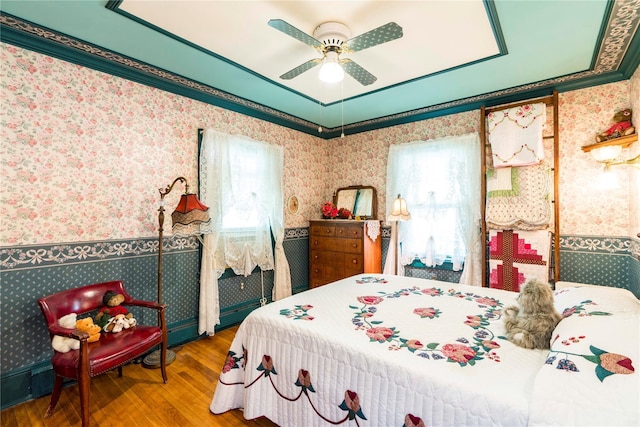 44 Jackson St, Fishkill, NY 12524 - bedroom with crown molding, wallpapered walls, multiple windows, and wood finished floors