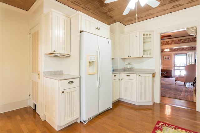 44 Jackson St, Fishkill, NY 12524 - kitchen featuring tasteful backsplash, white refrigerator with ice dispenser, a ceiling fan, and light wood finished floors