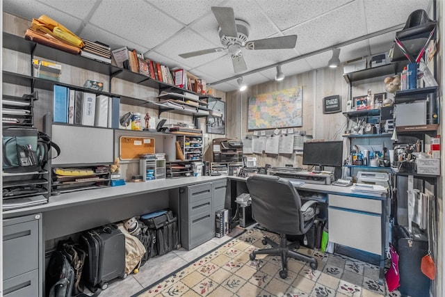 office area featuring light tile patterned floors, a ceiling fan, and a paneled ceiling