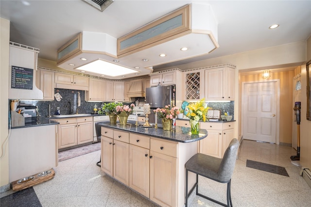 kitchen with light brown cabinetry, dishwasher, freestanding refrigerator, recessed lighting, and tasteful backsplash