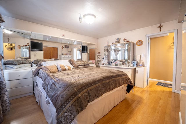 bedroom featuring light wood-type flooring
