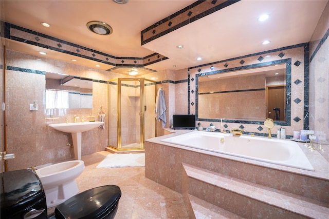 full bath featuring a bidet, a bath, tile walls, a stall shower, and recessed lighting