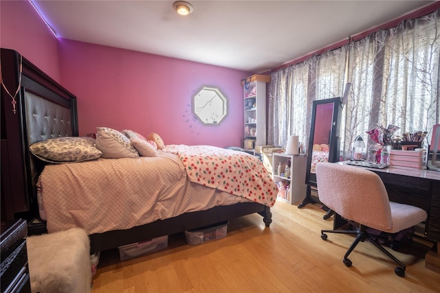 bedroom featuring wood finished floors
