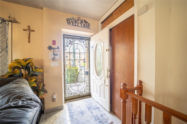 entrance foyer with light speckled floor
