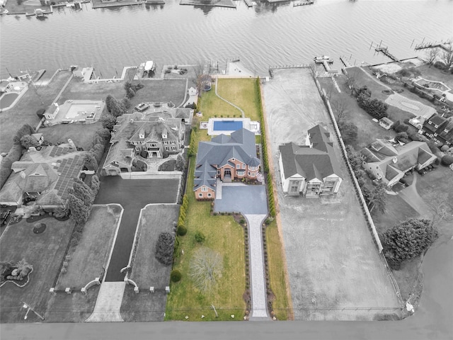 birds eye view of property featuring a water view and a residential view