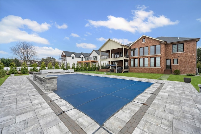 view of pool featuring a patio and a covered pool