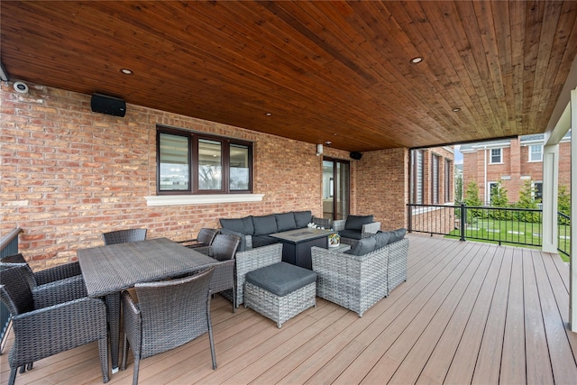 wooden deck featuring outdoor dining space and outdoor lounge area