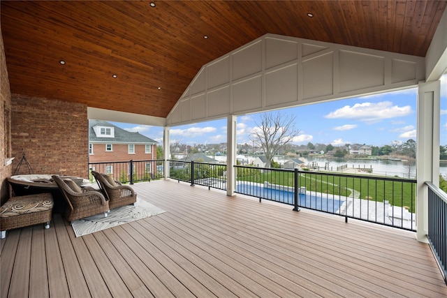 wooden deck featuring a water view