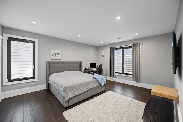 bedroom with baseboards, recessed lighting, visible vents, and hardwood / wood-style floors
