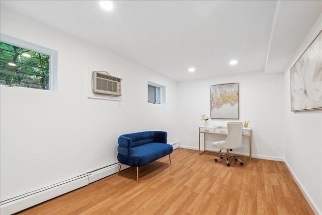 office area featuring a baseboard heating unit, a wall mounted AC, light wood-style floors, recessed lighting, and baseboards