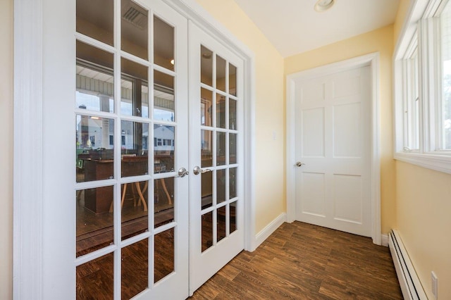 64 Harmon St, Long Beach, NY 11561 - doorway to outside with baseboard heating, french doors, dark wood finished floors, and baseboards