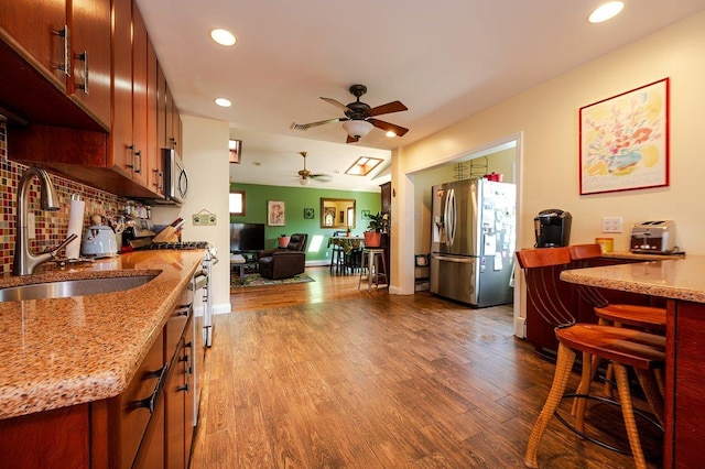 64 Harmon St, Long Beach, NY 11561 - kitchen featuring appliances with stainless steel finishes, a sink, a ceiling fan, dark wood-style flooring, and recessed lighting