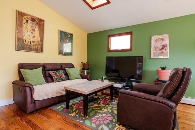 64 Harmon St, Long Beach, NY 11561 - living room featuring vaulted ceiling, wood finished floors, and baseboards