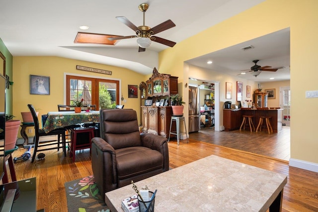 64 Harmon St, Long Beach, NY 11561 - living room featuring a ceiling fan, vaulted ceiling, a skylight, wood finished floors, and recessed lighting