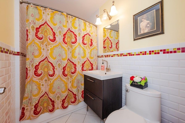64 Harmon St, Long Beach, NY 11561 - bathroom featuring tile walls, vanity, toilet, tile patterned floors, and a shower with shower curtain