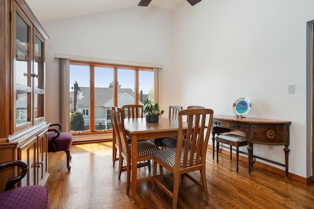 64 Harmon St, Long Beach, NY 11561 - dining area with wood finished floors, a baseboard heating unit, high vaulted ceiling, ceiling fan, and baseboards