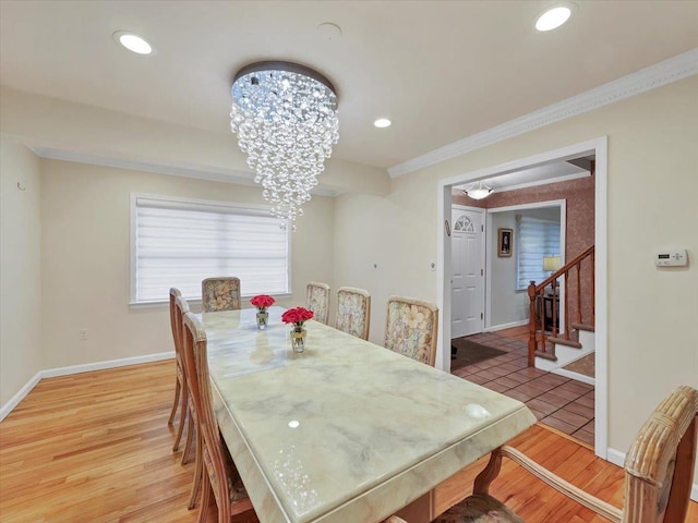 dining area with stairway, baseboards, an inviting chandelier, and recessed lighting