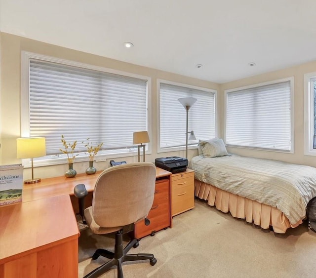 bedroom featuring light carpet