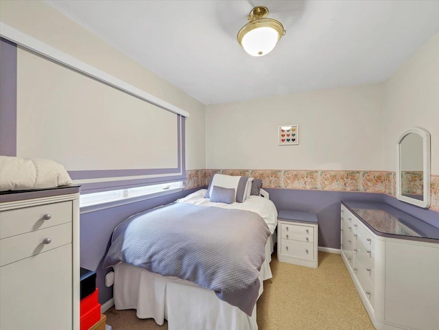 bedroom with light colored carpet