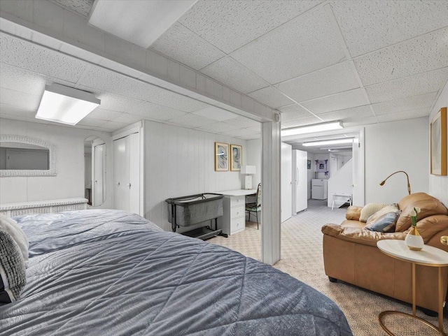 bedroom with carpet and a drop ceiling