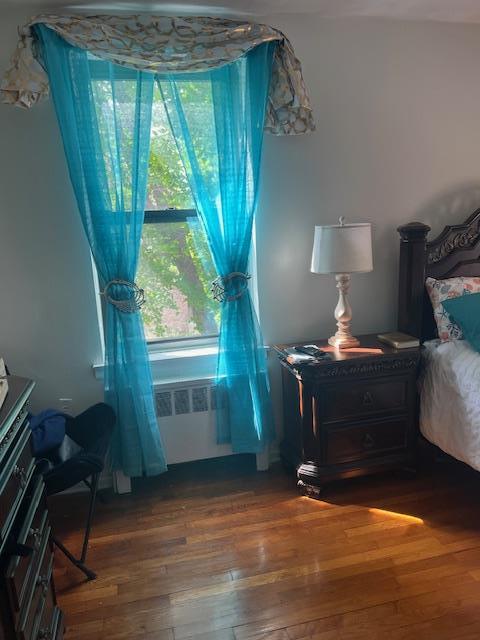 bedroom featuring wood finished floors