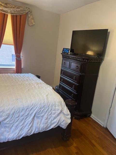 bedroom with wood finished floors