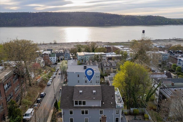 birds eye view of property featuring a water view