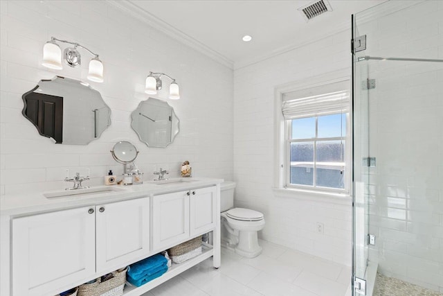 bathroom with crown molding, tile walls, a shower stall, and a sink