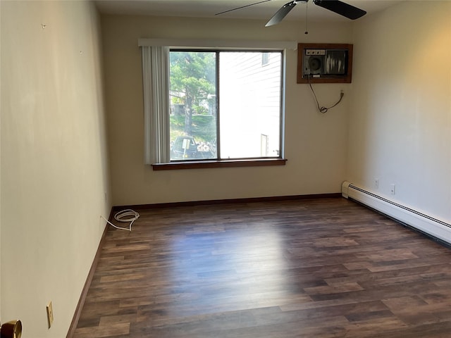empty room featuring a baseboard radiator, baseboards, ceiling fan, and wood finished floors