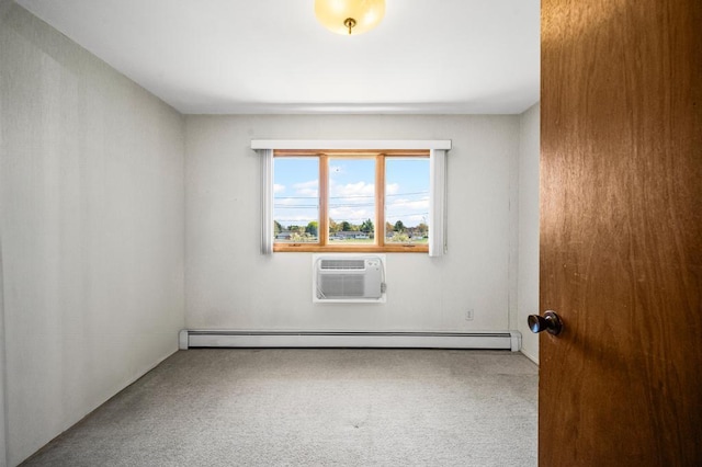 unfurnished room with a baseboard heating unit, a wall mounted AC, and carpet