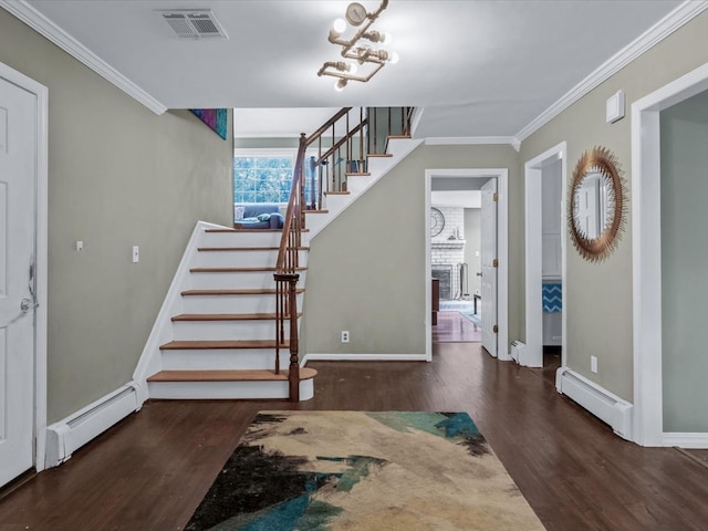 9 Cresthill Pl, Smithtown, NY 11787 - foyer entrance with stairway, a baseboard radiator, wood finished floors, and ornamental molding