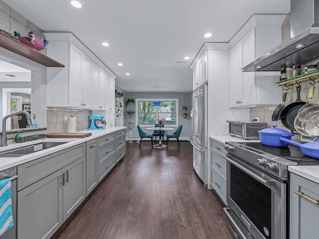 9 Cresthill Pl, Smithtown, NY 11787 - kitchen with appliances with stainless steel finishes, wall chimney exhaust hood, a sink, gray cabinetry, and light countertops