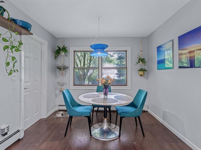 9 Cresthill Pl, Smithtown, NY 11787 - dining area featuring a baseboard heating unit, dark wood-style floors, and baseboards